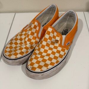 Vans Men size 9 Women’s size 10.5  Orange and White Checkered slip on